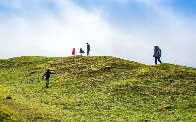 Family hiking on hill